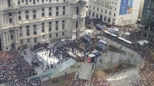 Photo by Tim Keough, taken from the 16th floor of 1515 Market Street: Massive crowds gathered at the end of the parade route at City Hall.